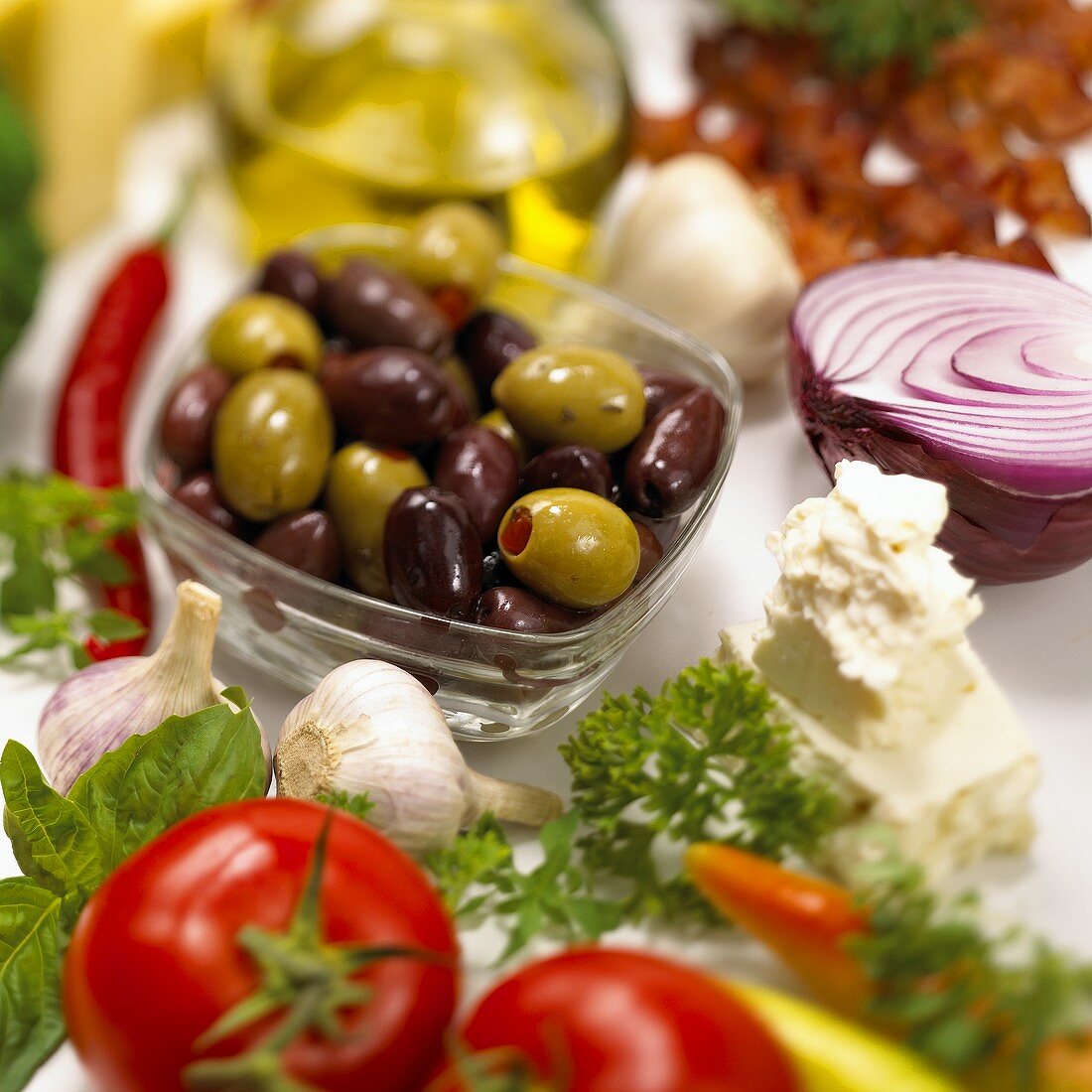 Still life with olives, vegetables and cheese