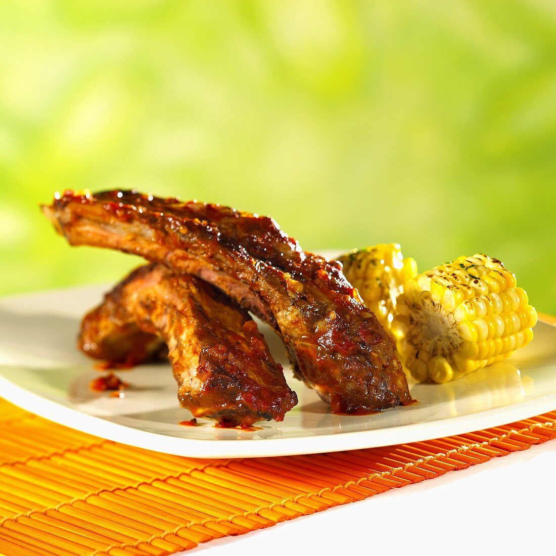 Barbecued beef ribs with corncobs