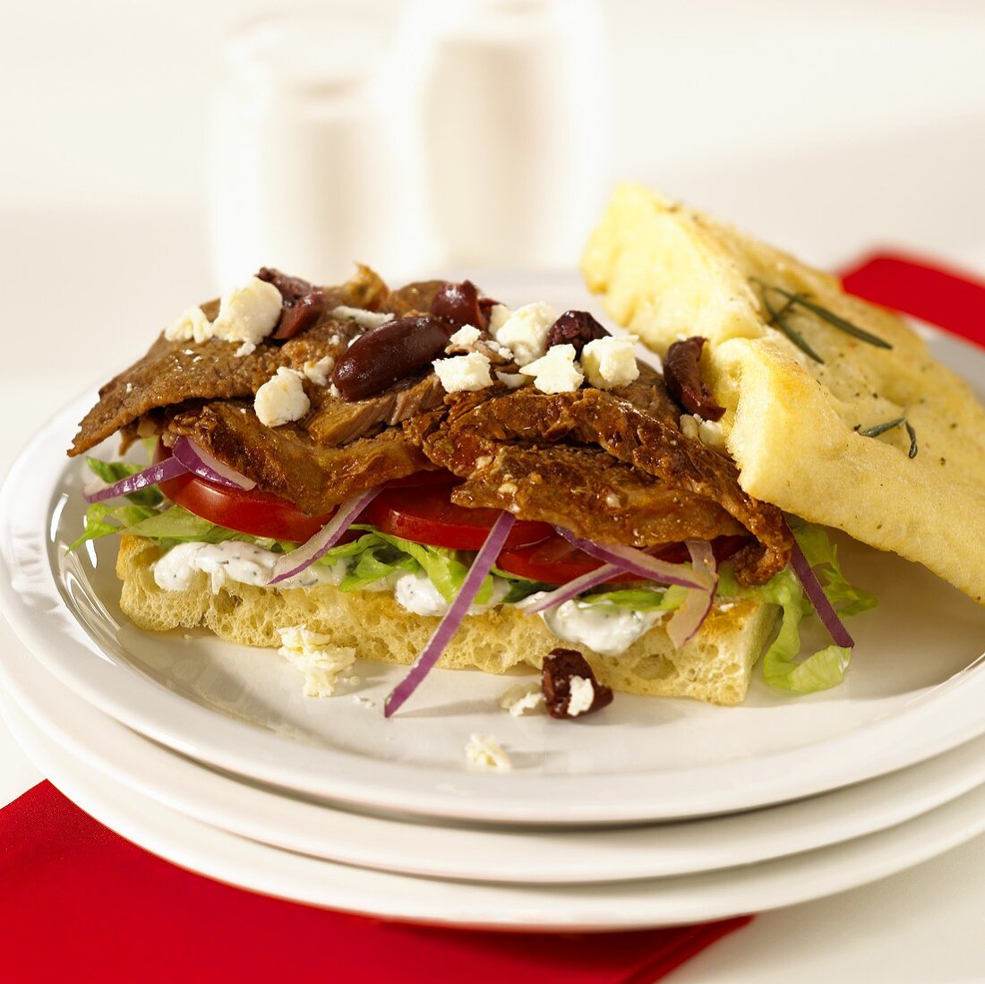 Pita bread with beef, feta and olives