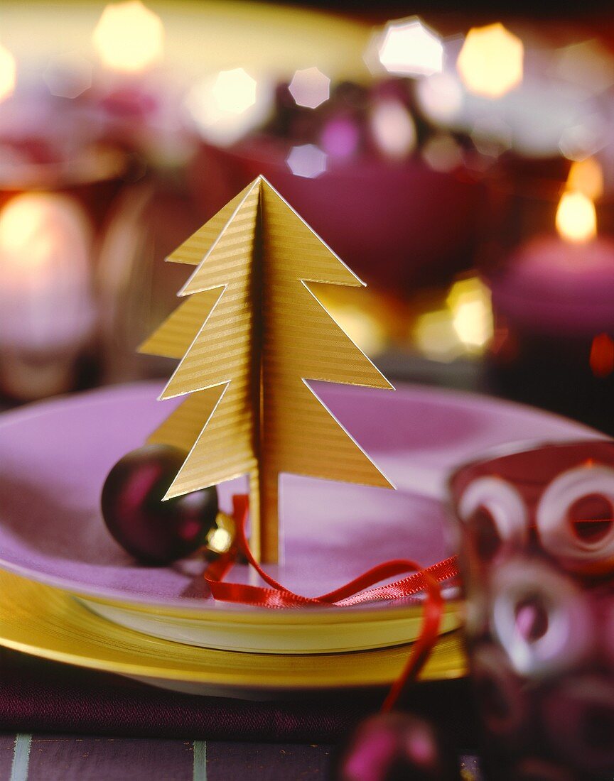 Christmas place setting with paper fir tree and bauble