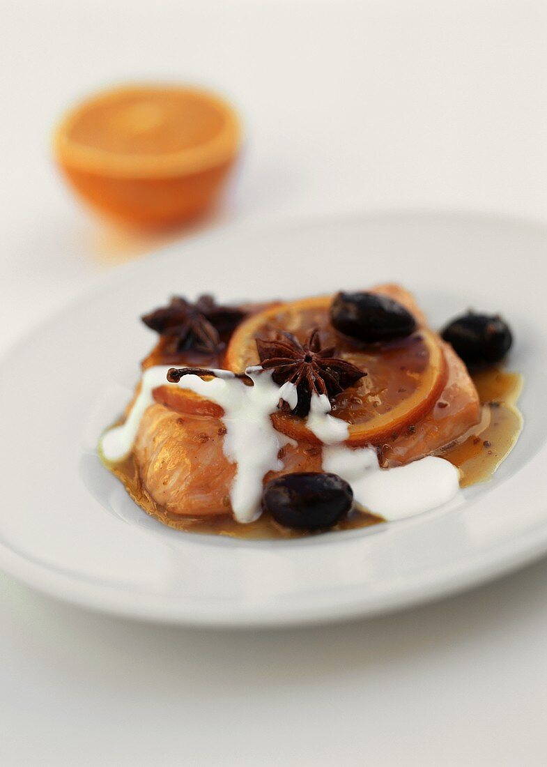 Salmon in orange butter with star anise and black olives