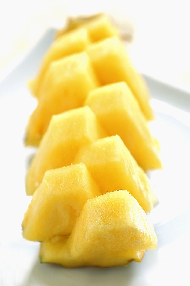 Diced pineapple on pineapple skin