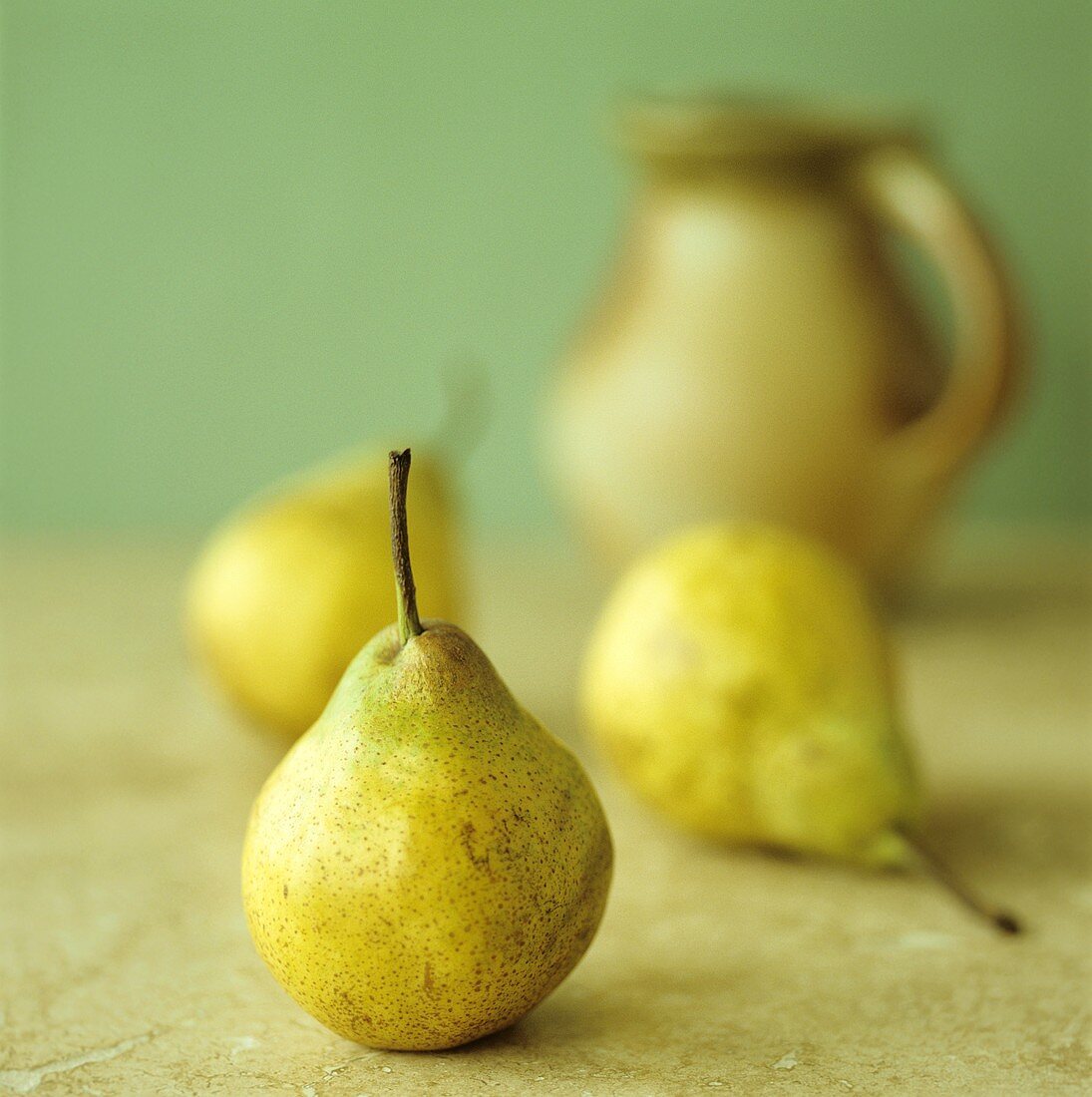 Three pears, a jug behind