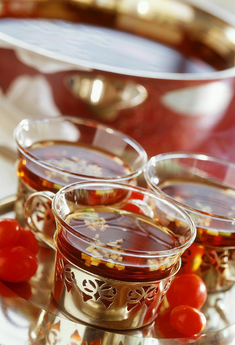 Tomato consommé served in glasses