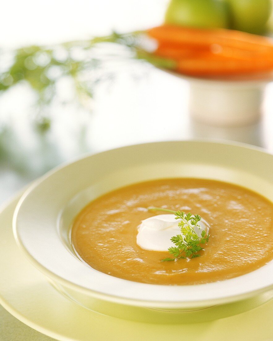 Creamed carrot soup with a blob of sour cream
