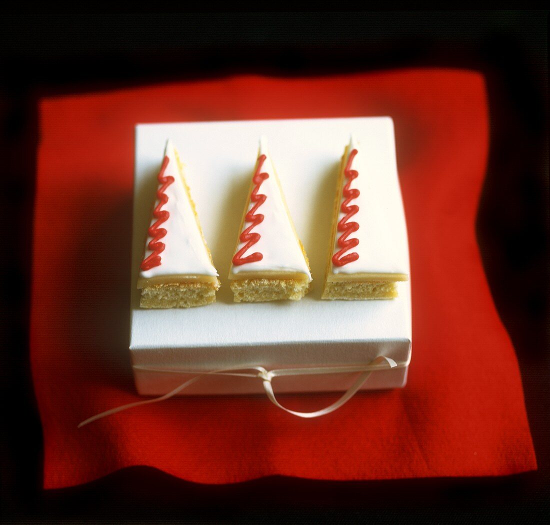 Marzipan-coated pieces of sponge cake in shape of Xmas tree