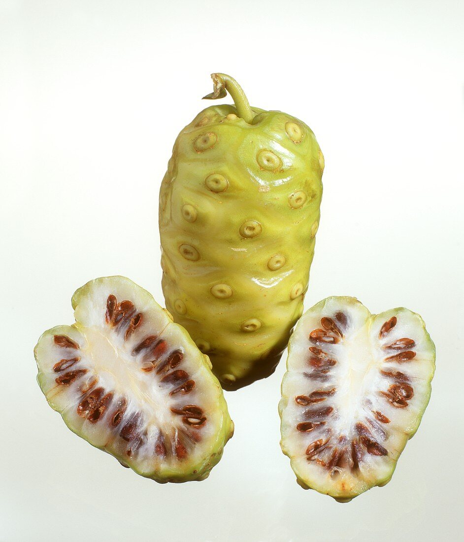 Whole and halved noni