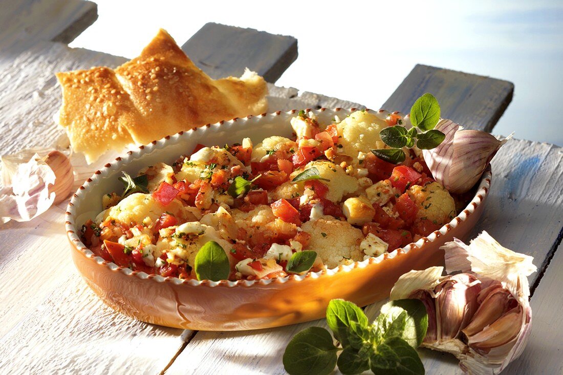 Cauliflower and tomato bake in a baking dish