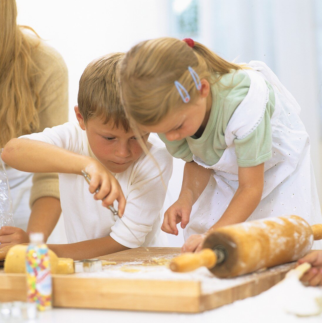 Children baking biscuits