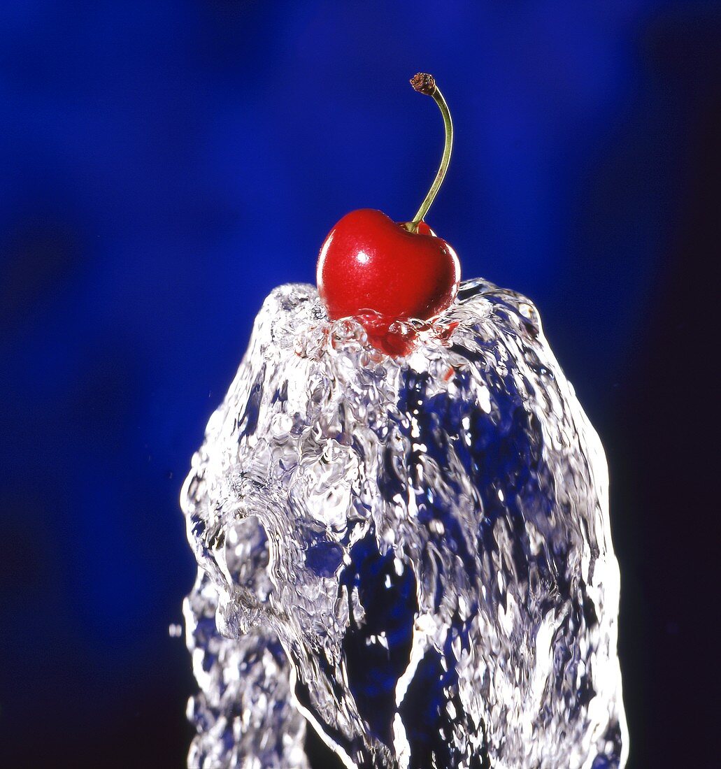 Cherry on stream of water