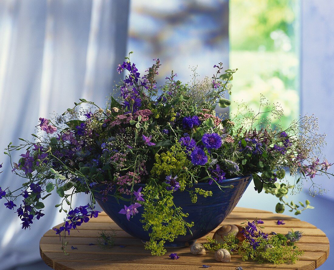 Bunch of meadow flowers: cornflowers, lady's mantle, larkspur..