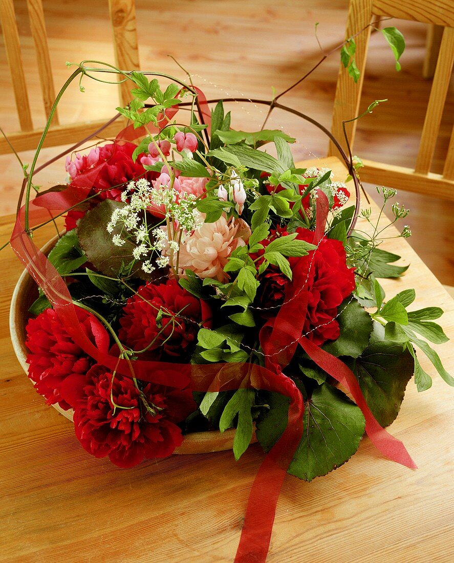 Arrangement of different coloured peonies