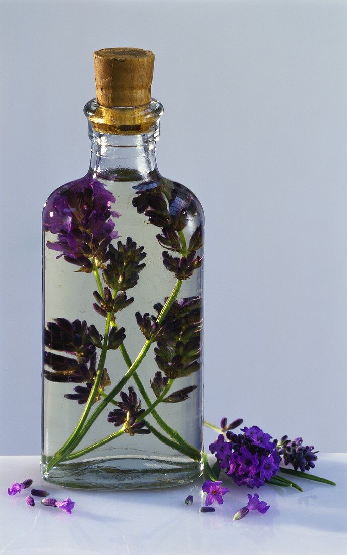 Glass bottle of lavender oil with cork