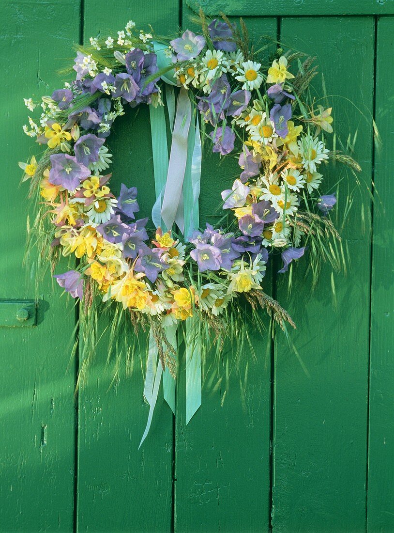 Wreath of marguerites, bluebells, aquilegia, grasses