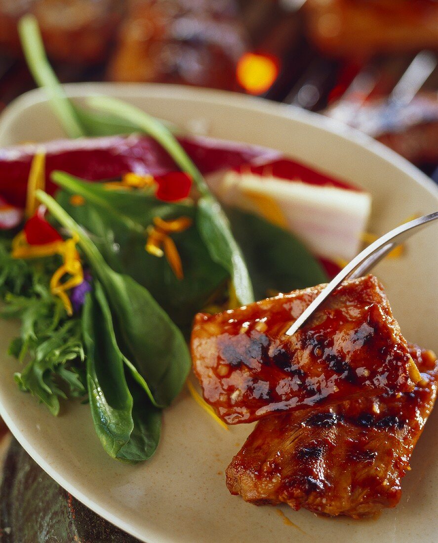 barbecued pork ribs with barbecue sauce