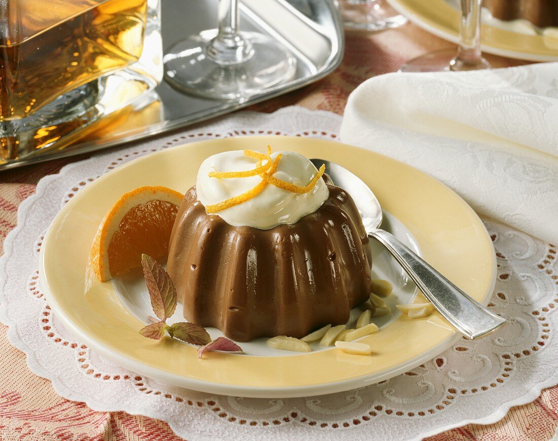 Turned-out chocolate blancmange with almonds and orange cream