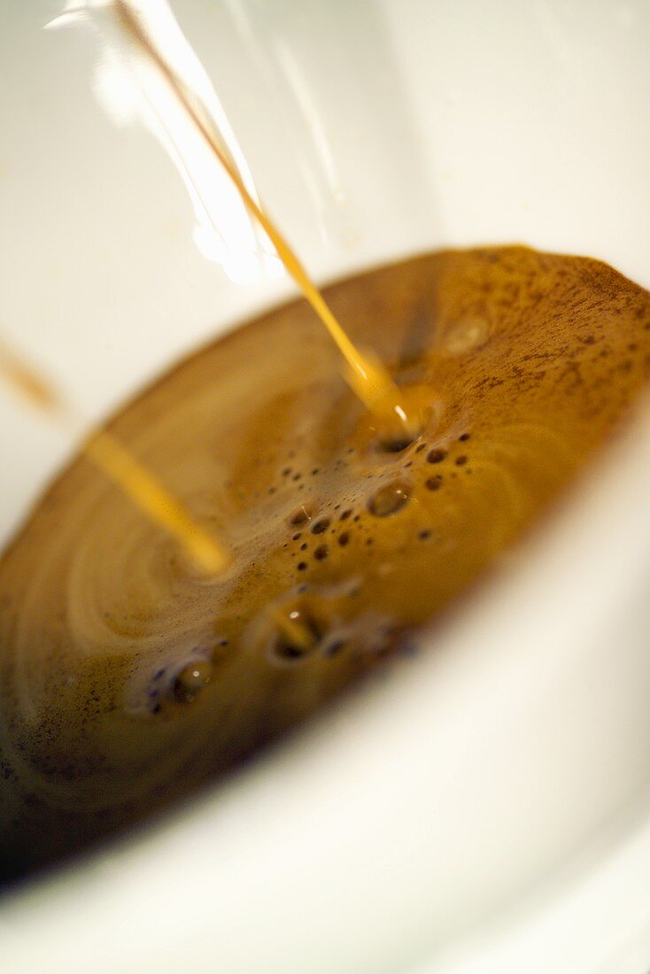 Espresso running into an espresso cup