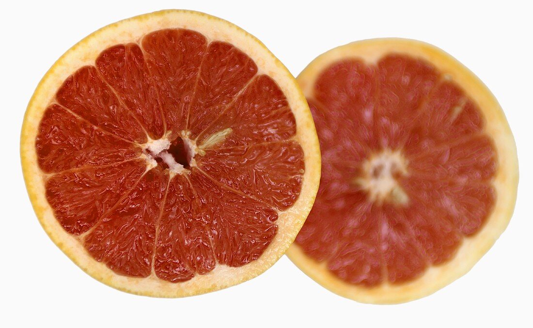 Two red grapefruit halves