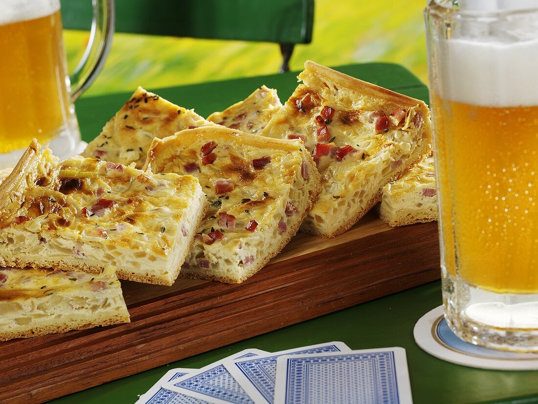 Several pieces of onion tart with beer