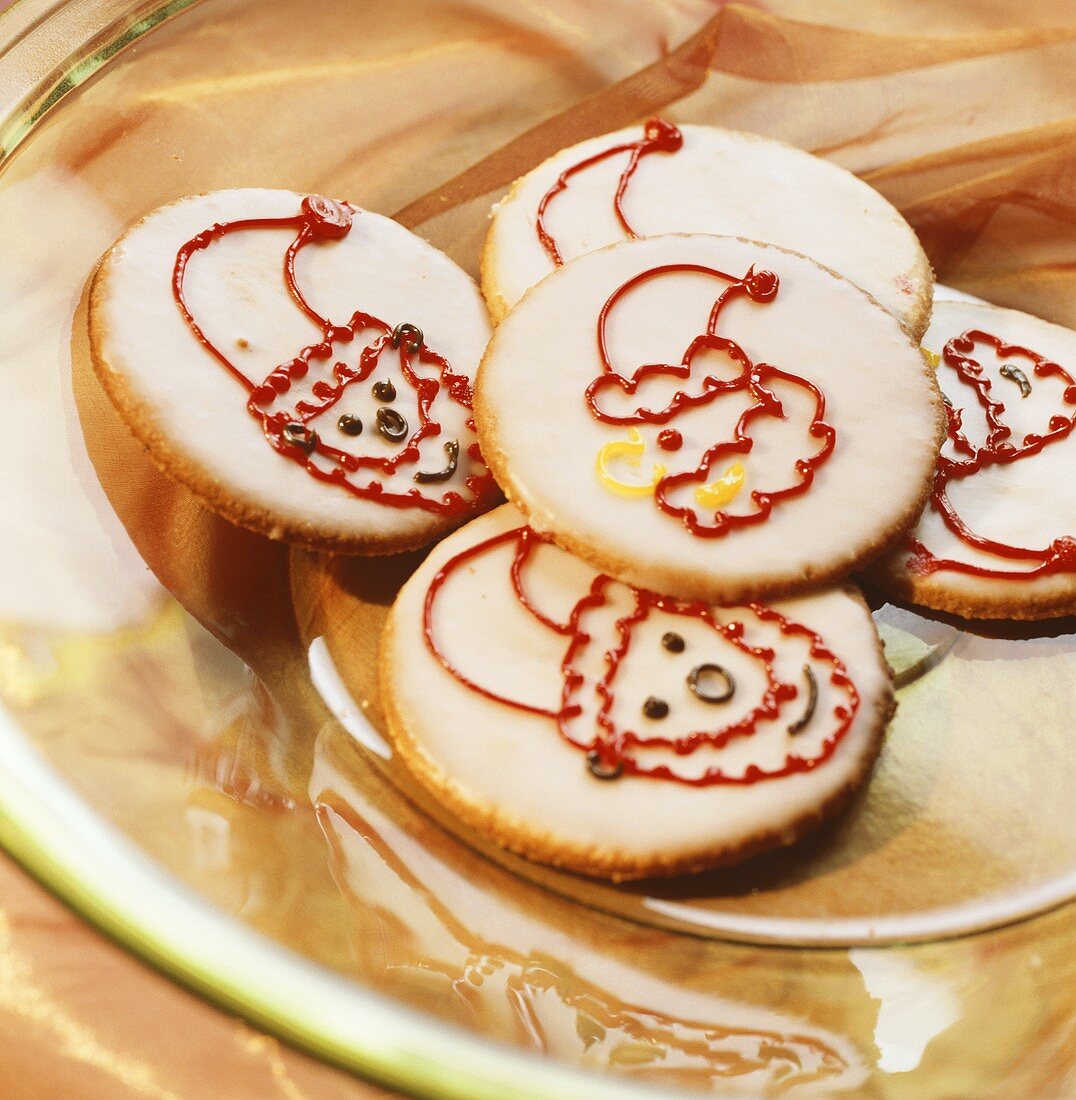 Several butter biscuits with Father Christmas faces
