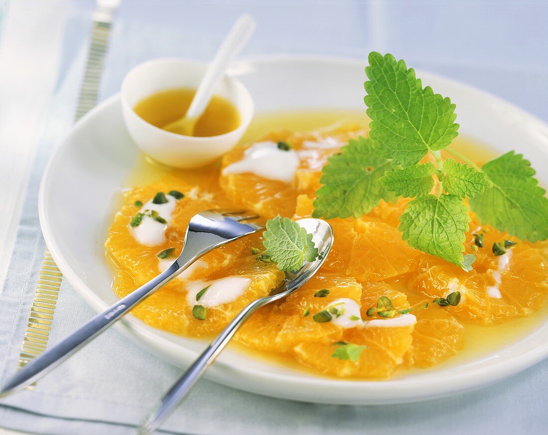 Orange carpaccio with yoghurt and pistachios