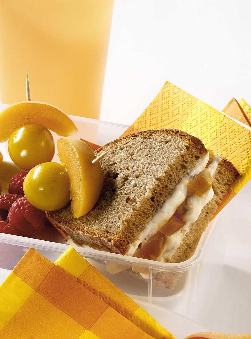 Wholemeal bread with walnut butter & apricots; skewered fruit