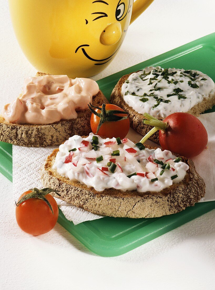 Three open sandwiches with different quark spreads