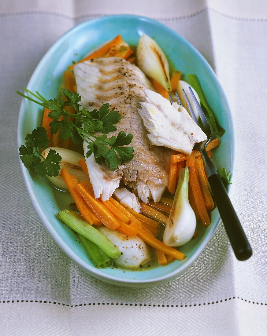 Steamed perch fillet on carrots