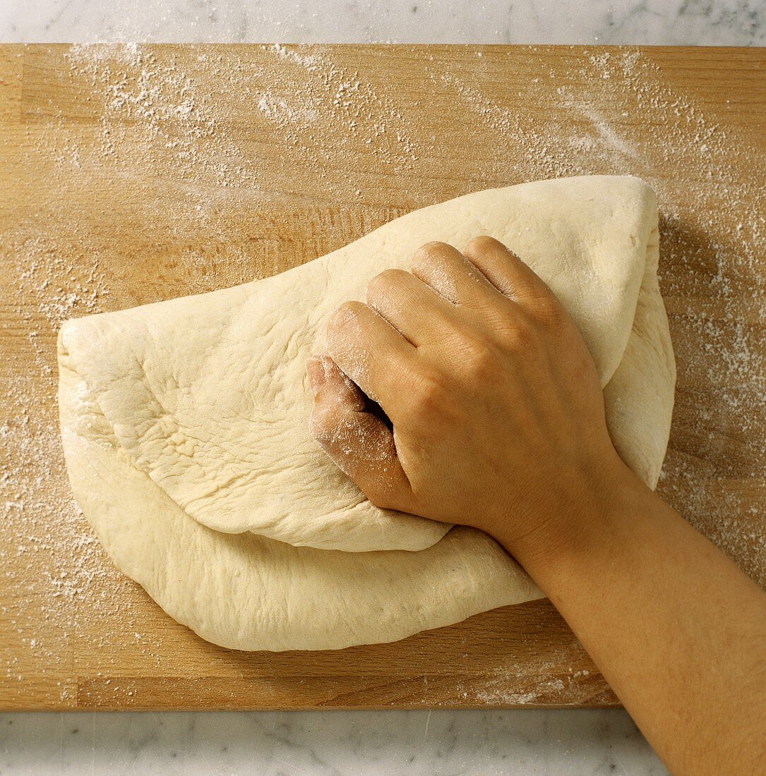 Pressing bread dough