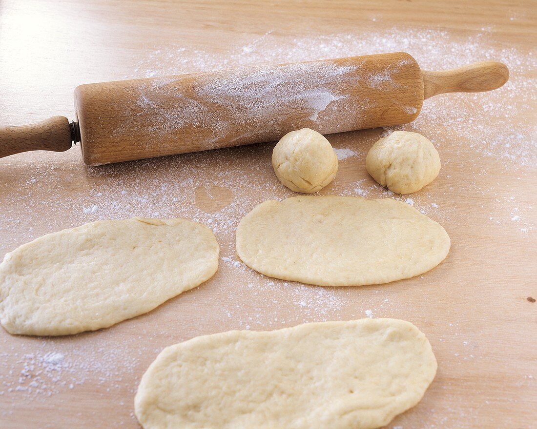 Making filled croissants: rolling out the pastry