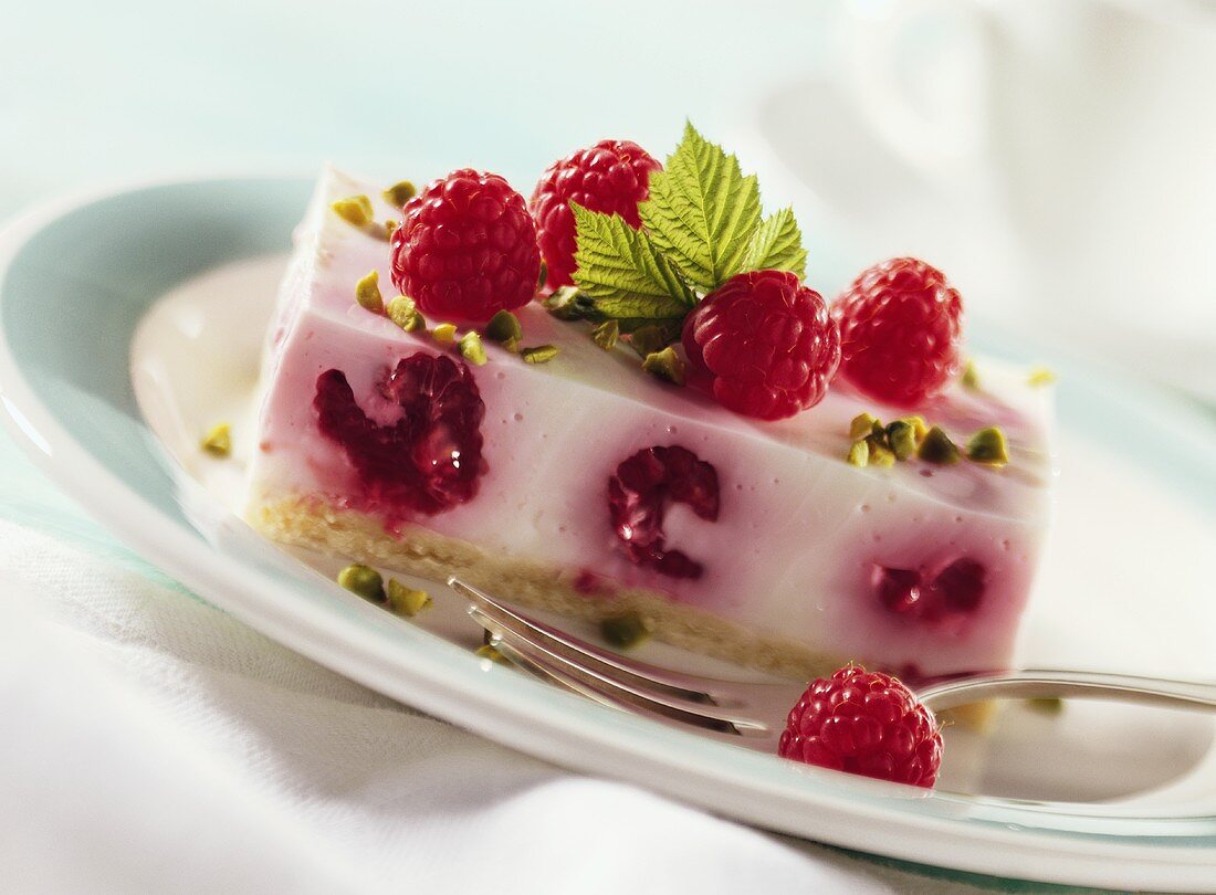 Kefir slice with raspberries and pistachios