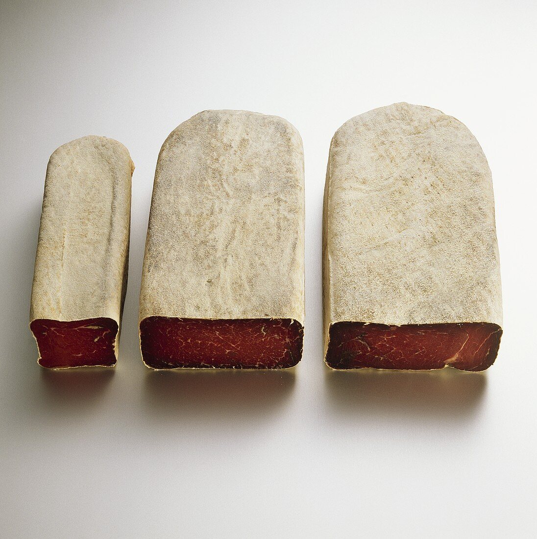 Three pieces of dry-cured beef (Bündnerfleisch)