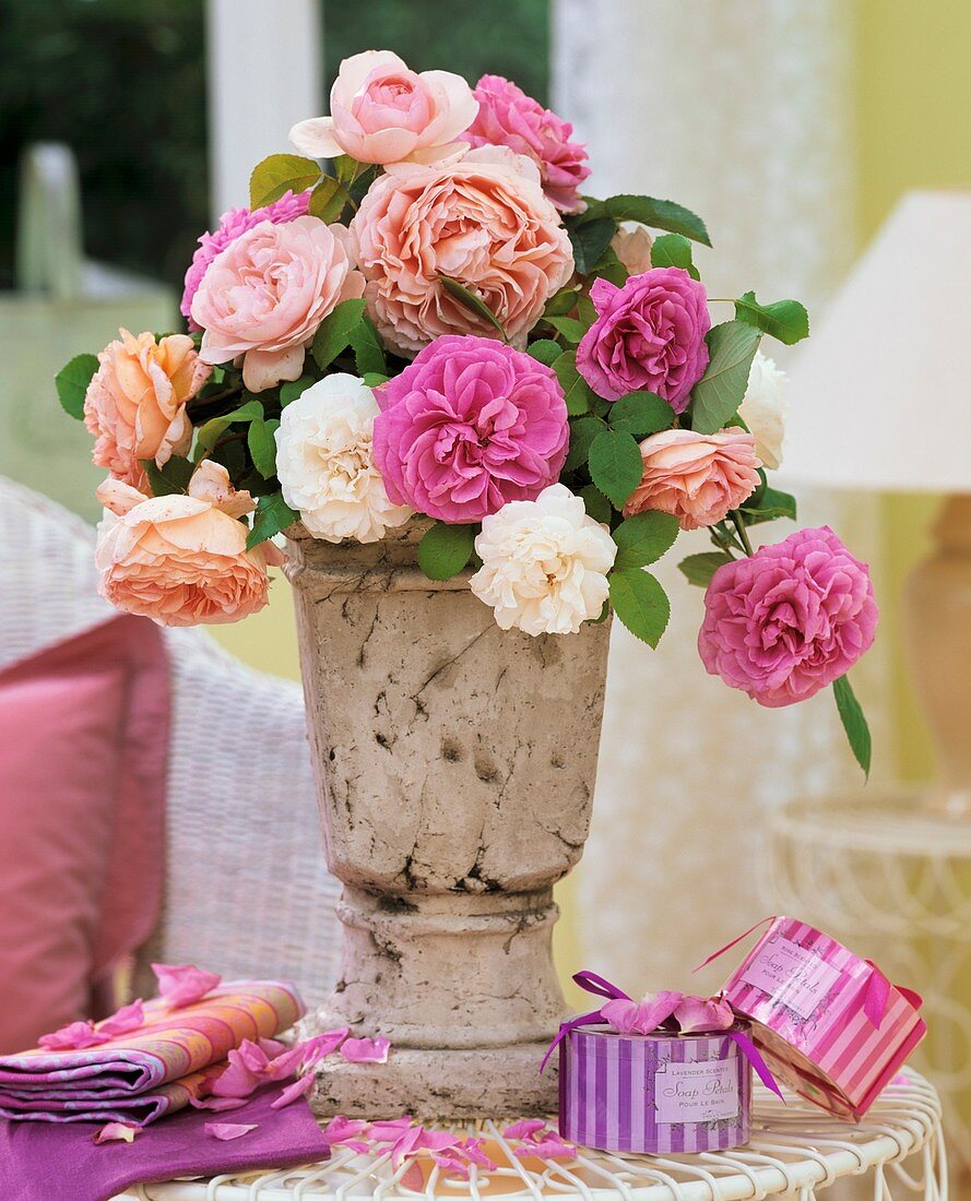 Perfumed roses in an antique vase, rose & lavender bath salts