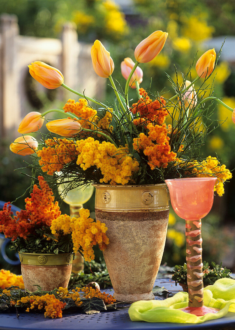 Spring arrangement of mimosa and tulips
