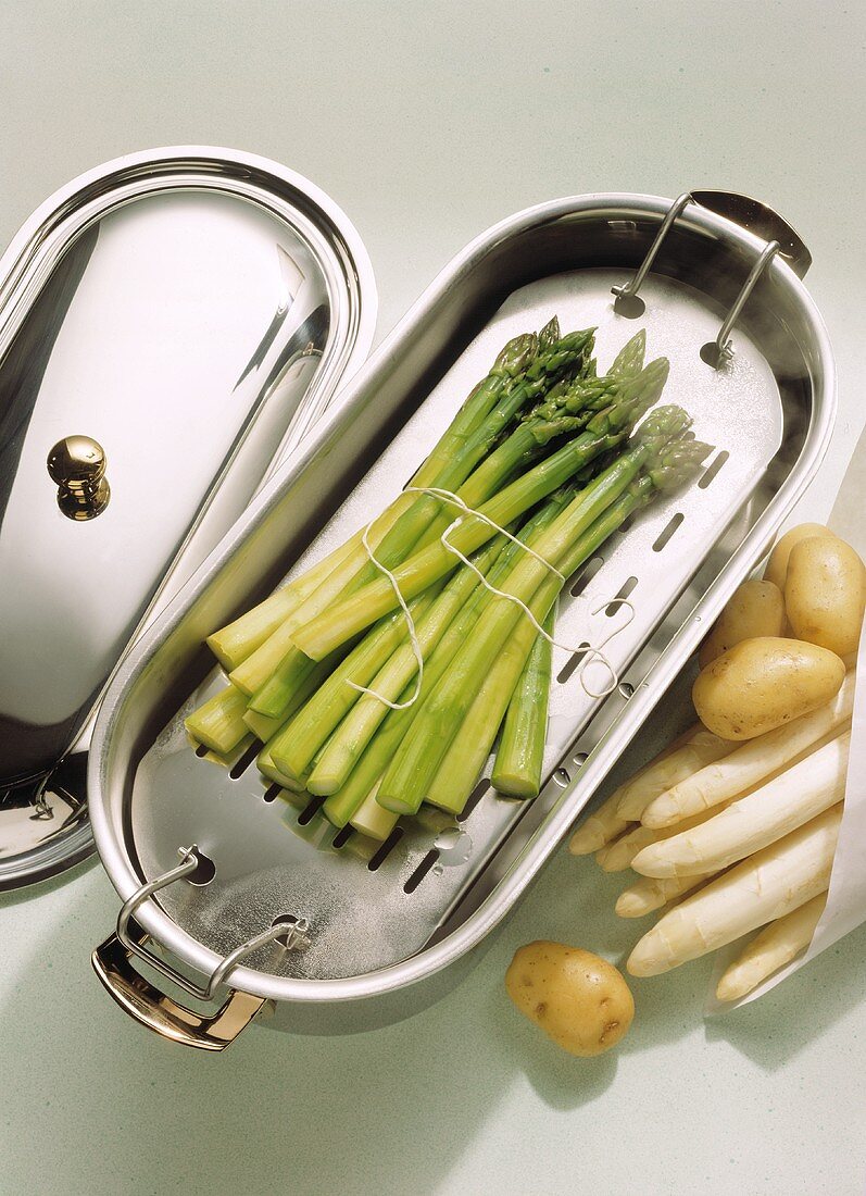 Green asparagus in an asparagus pan