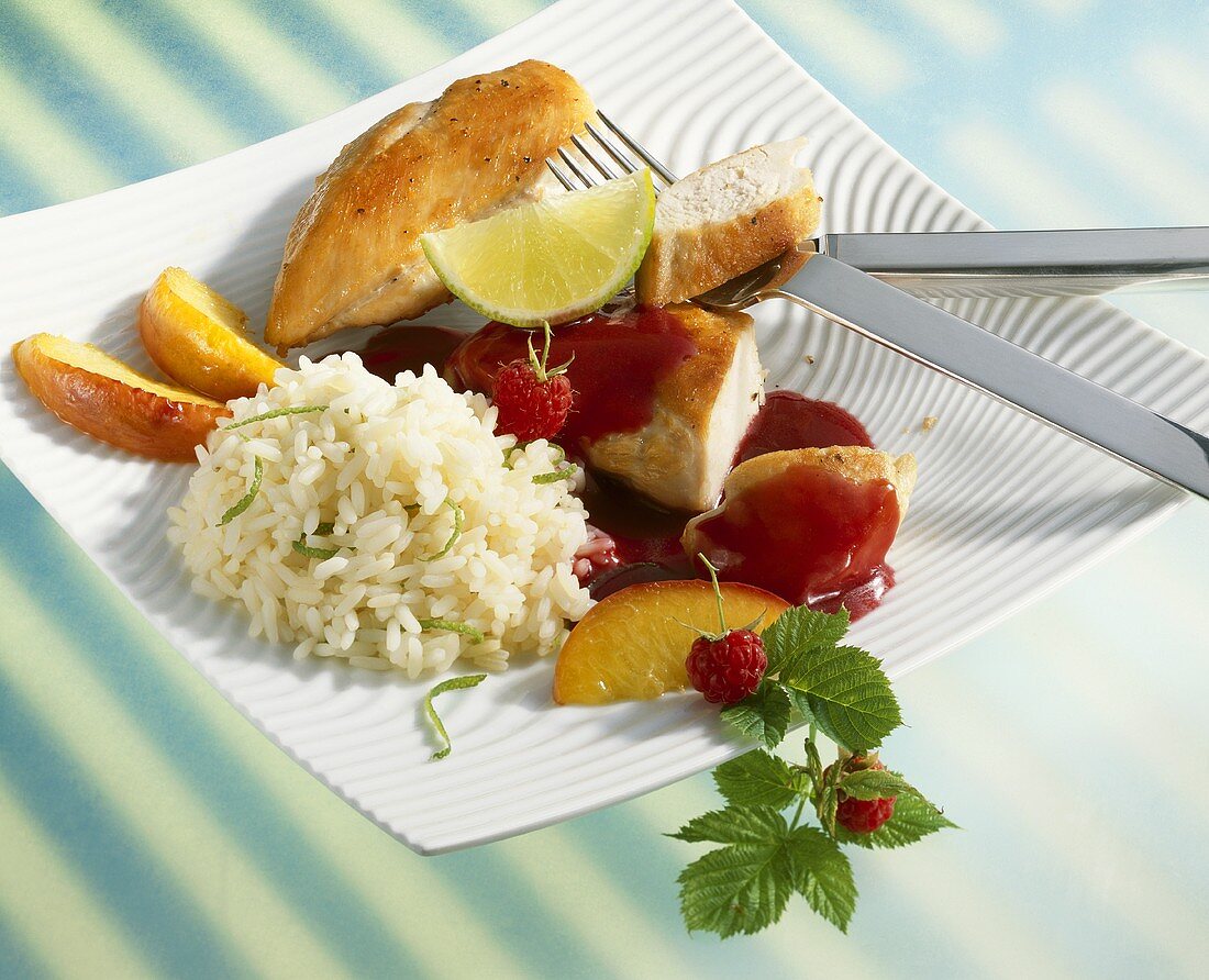 Chicken breast with raspberry sauce, peaches and lime rice