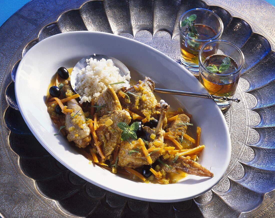Guinea-fowl with pumpkin and olives (Tunisian dish)