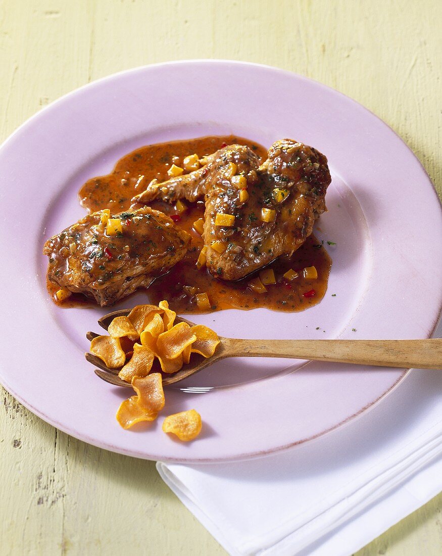 Chicken in spicy pepper sauce with sweet potato crisps