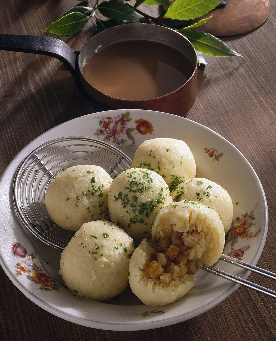 Stuffed potato dumplings with gravy
