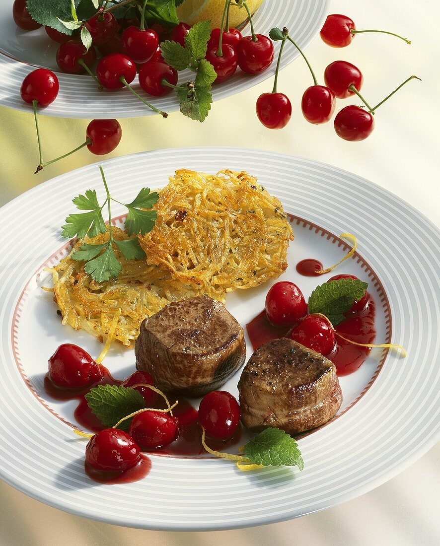 Venison medallions with cherry sauce and potato rosti