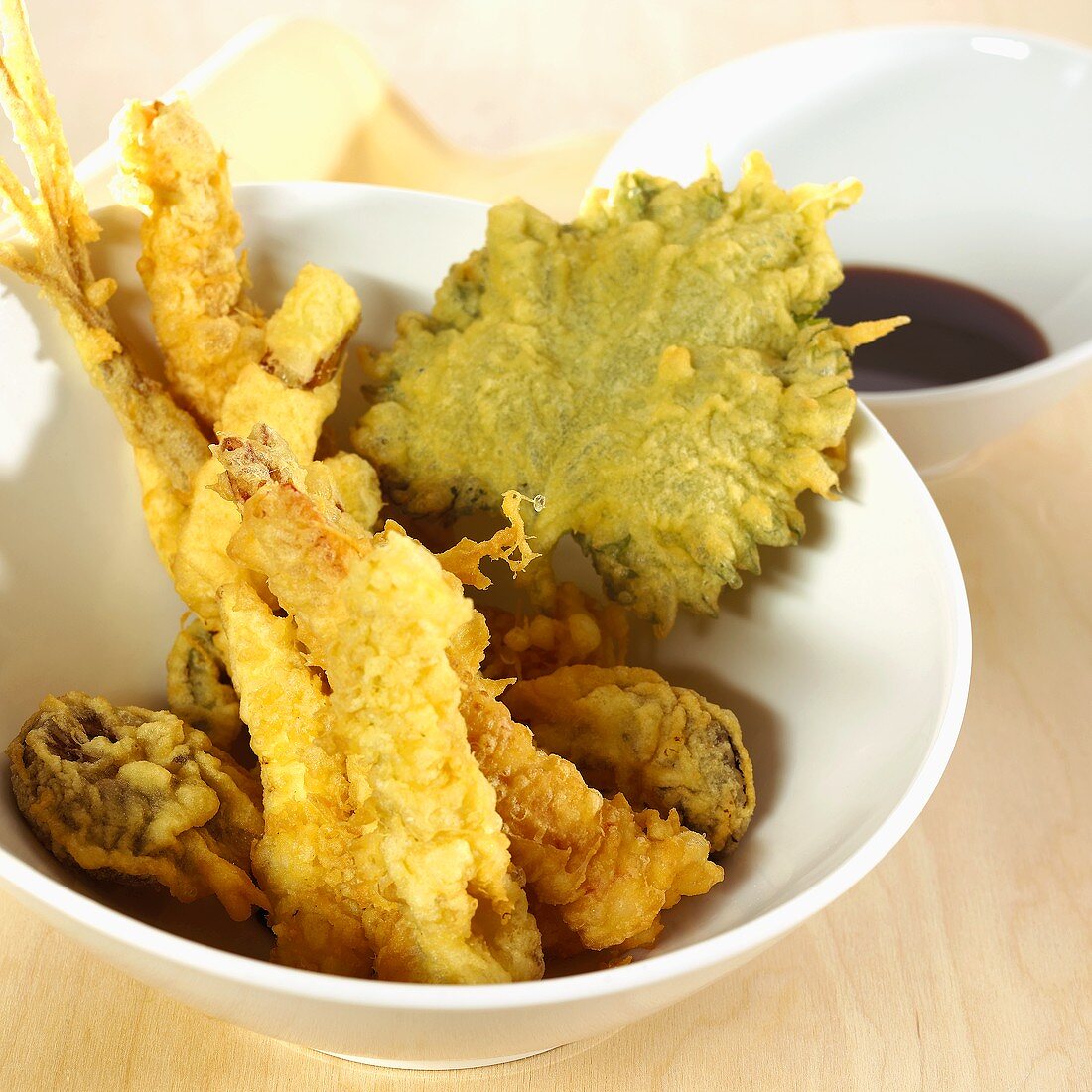 Seafood and vegetable tempura in a small bowl