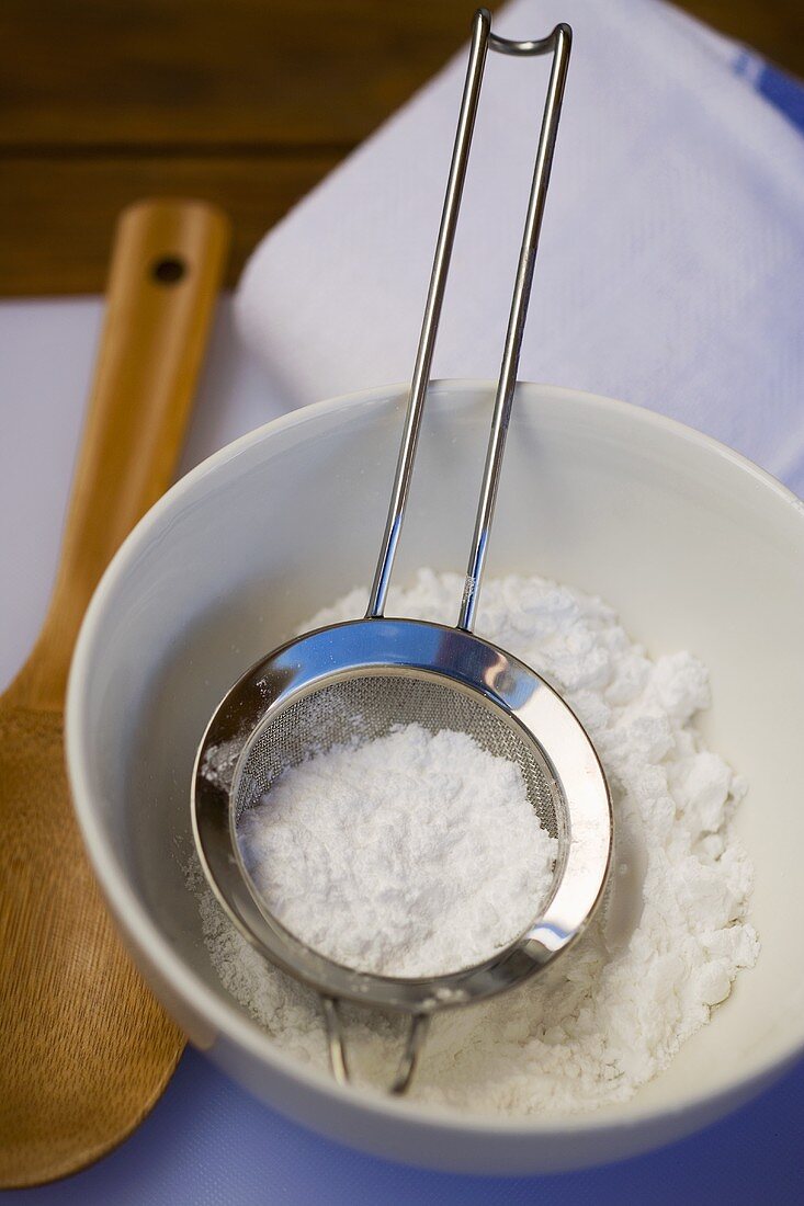 Sugar for glacé icing with sieve