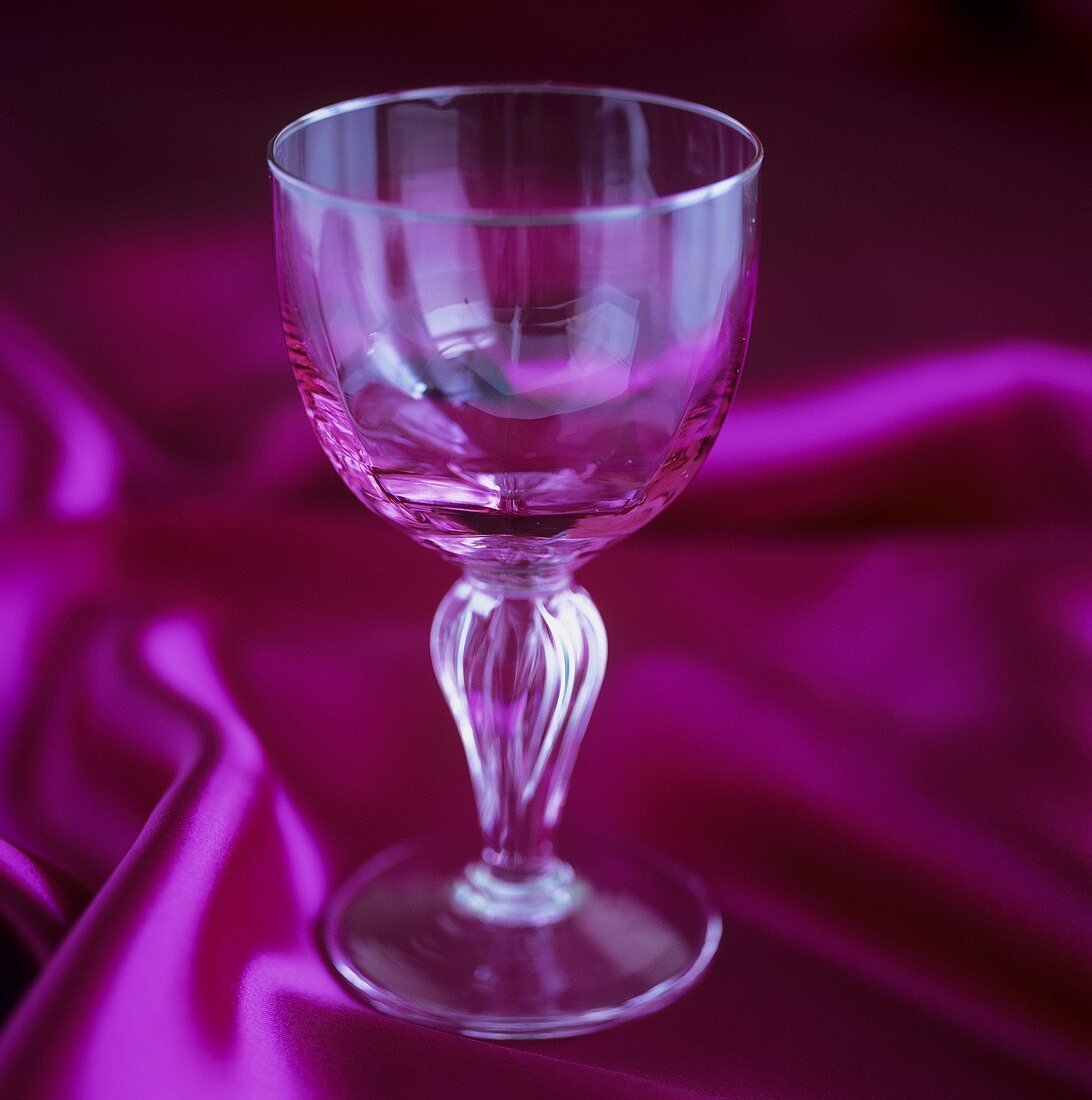 A wine glass on silk