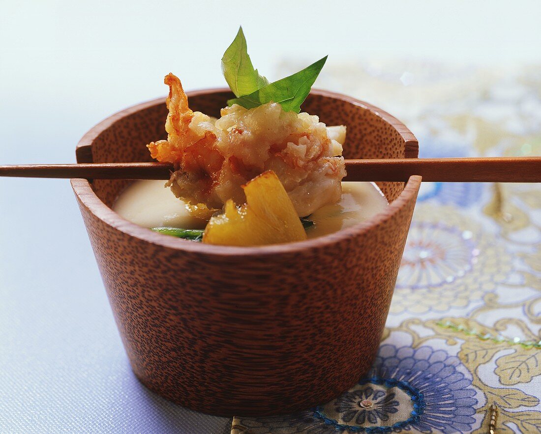 Spiny lobster in almond tempura over polenta soup