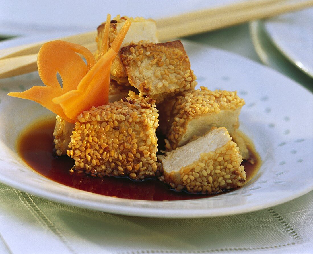 Baked tofu cubes with sesame seeds & carrot butterfly