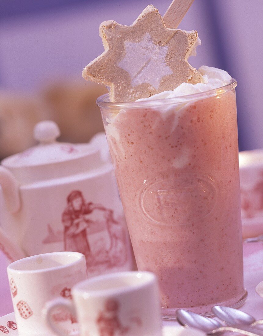 Strawberry milkshake with cream rosette & ice star on stick