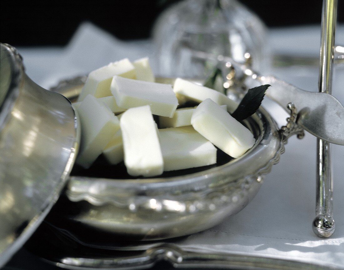 Butter Pats in a Silver Bowl