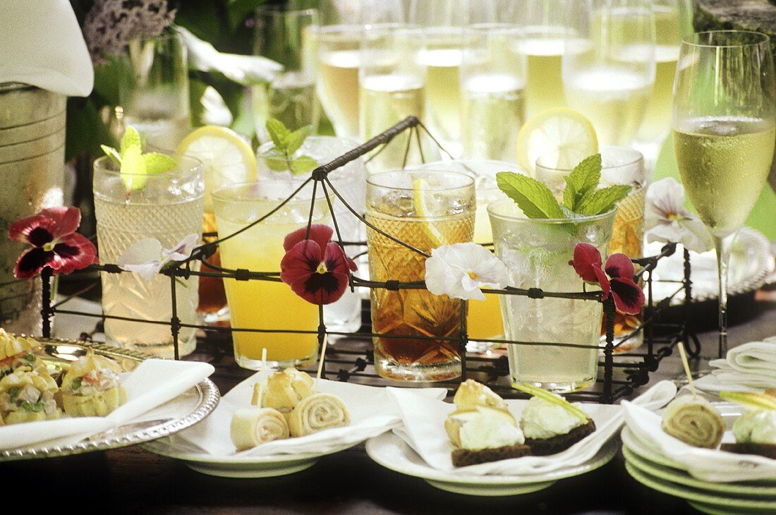 Buffet with champagne, drinks & various snacks (close-up)