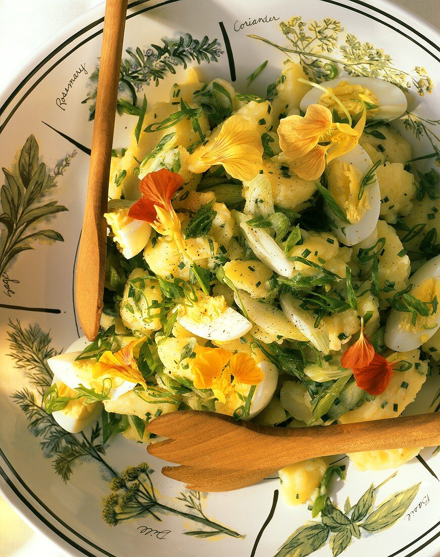 Potato salad with herbs, hard-boiled eggs & flowers