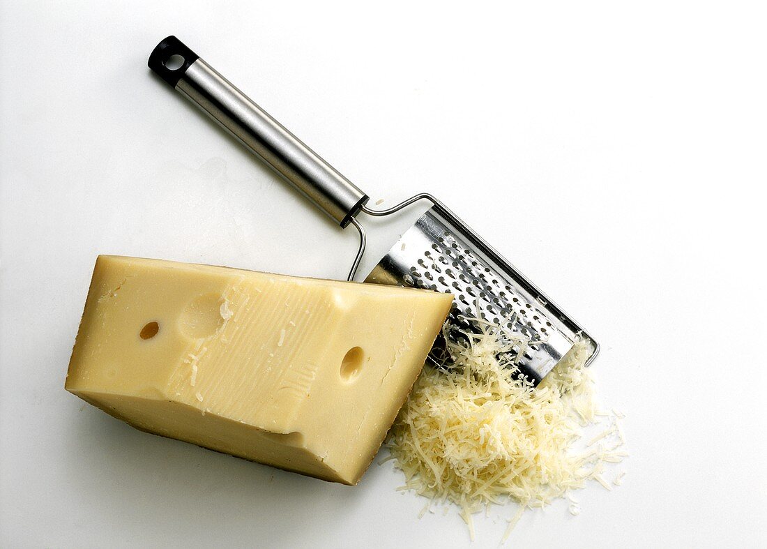 Emmental cheese in a piece & grated with cheese grater
